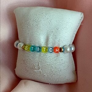 🟢 Disney Pearl clay bead with colored letters (stitch)